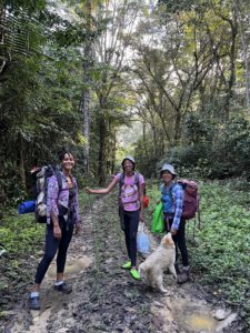 Standing at the beginning of the forest trail with two friends- Tracy & Gesiye- and our small dog- Grimey
