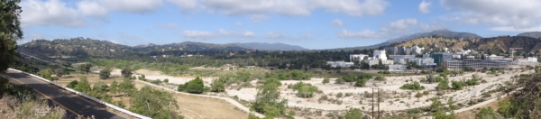 A panoramic view of the dry streambed. Jet propulsion laboratory is visible on the right.