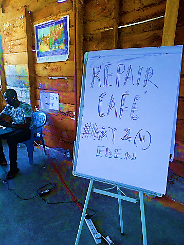 Two side by side images- the first one depicts a single-floor building structure, with four people near the entrance and two children playing in the front area; the second shows a white board with the words “REPAIR CAFE # DAY 2 Eden” 