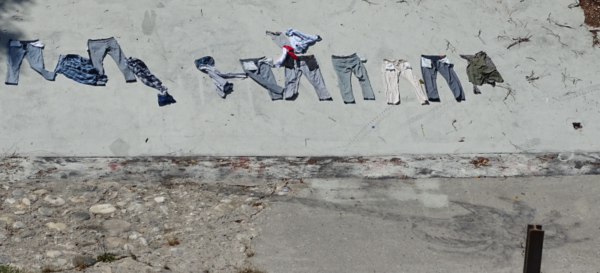 Clothes drying on the sloped channel wall.