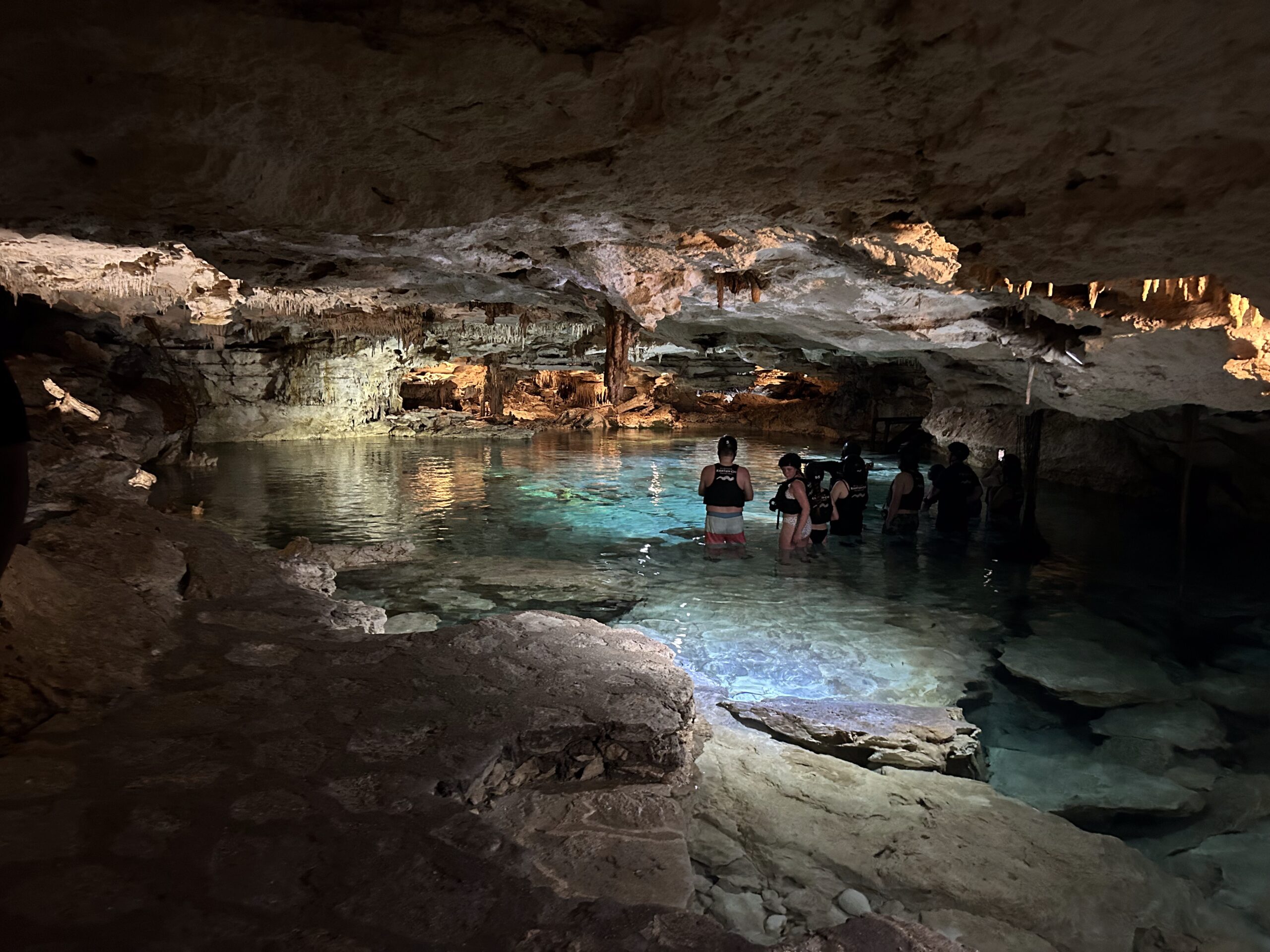 underground landscape naturally and artificially illuminated with some presence of tourists